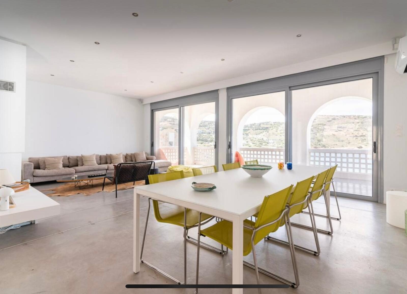 Open plan living and dining with arched sea view terrace