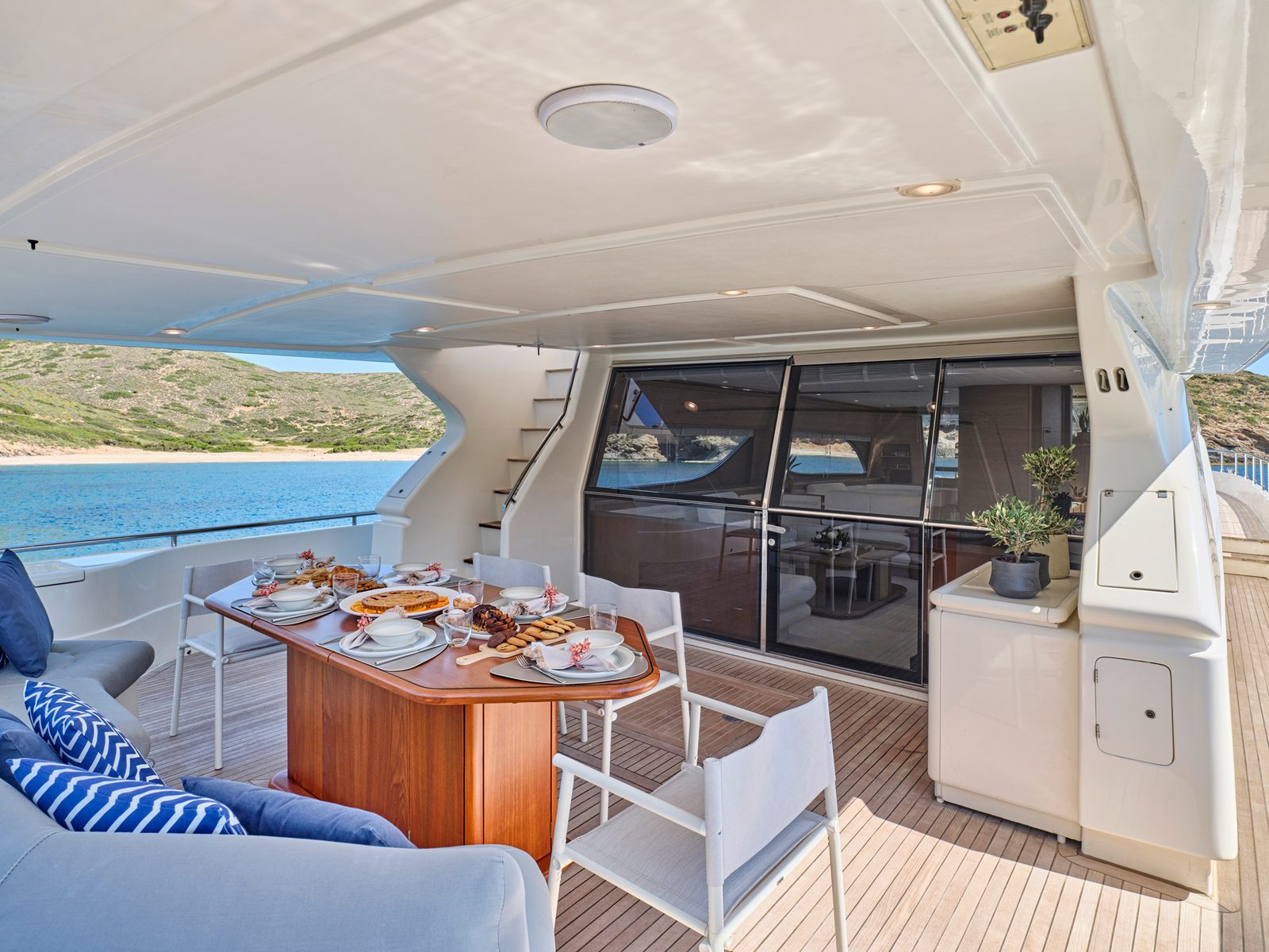 Upper deck dining on Apeiron Blue in a cove