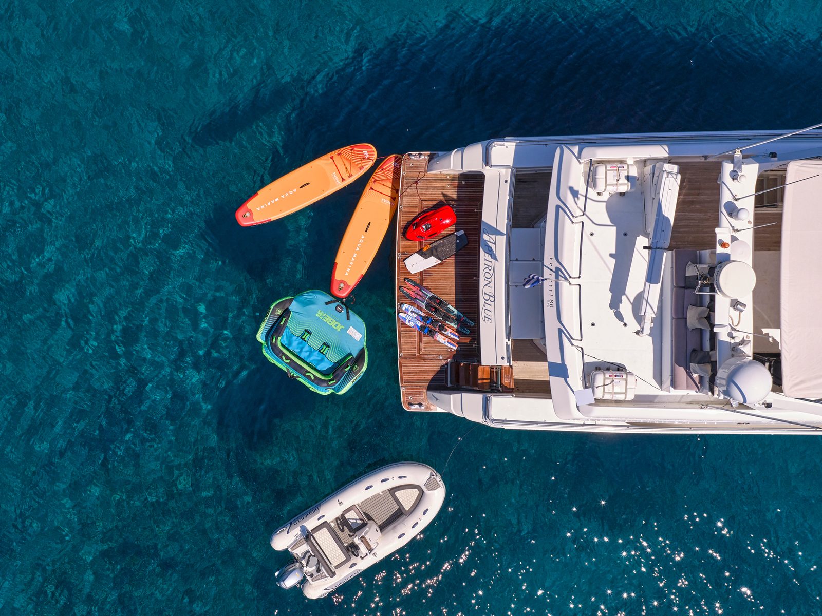 Apeiron Blue swim platform loaded with SeaBob, waterskis and wakeboard